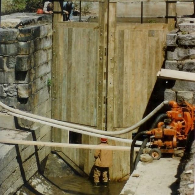HP&B founder Ridge Shinn, stands in the lock chamber before the new gate, while pumps keep the water from filling the chamber.