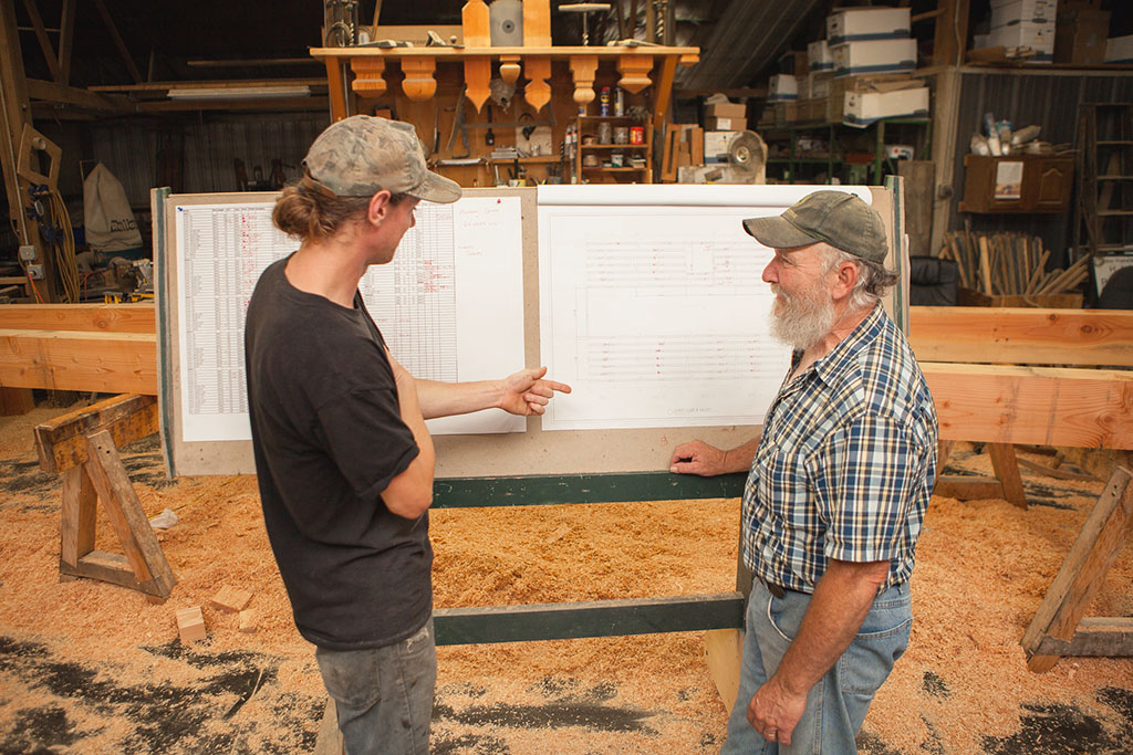 Timber Craftsmen Reviewing the Plans