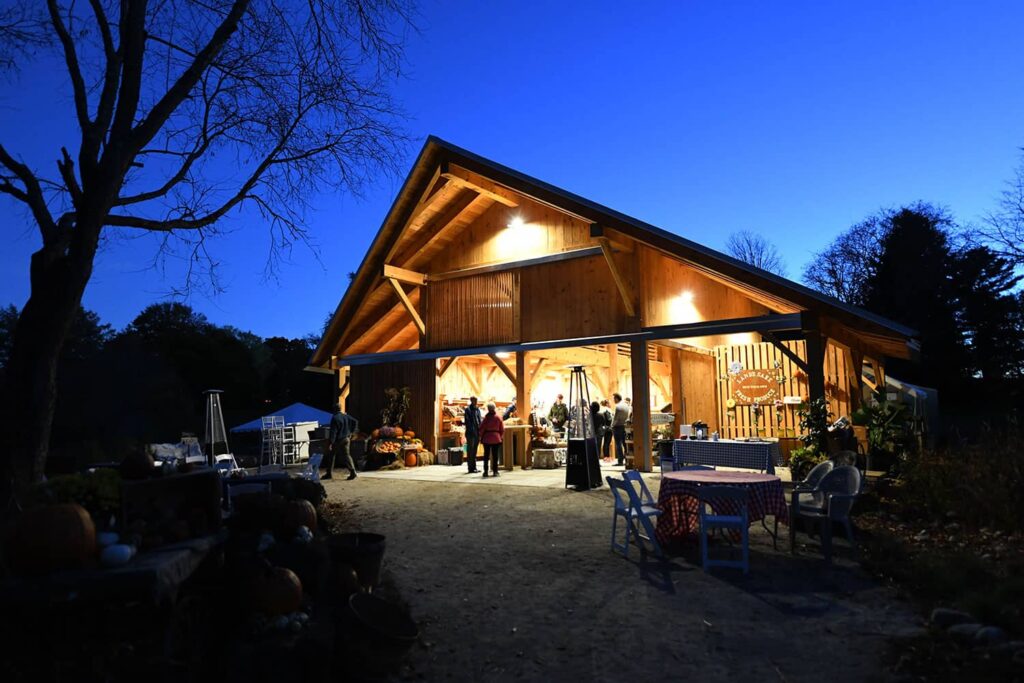 Lands Sake Farm timber frame barn at night