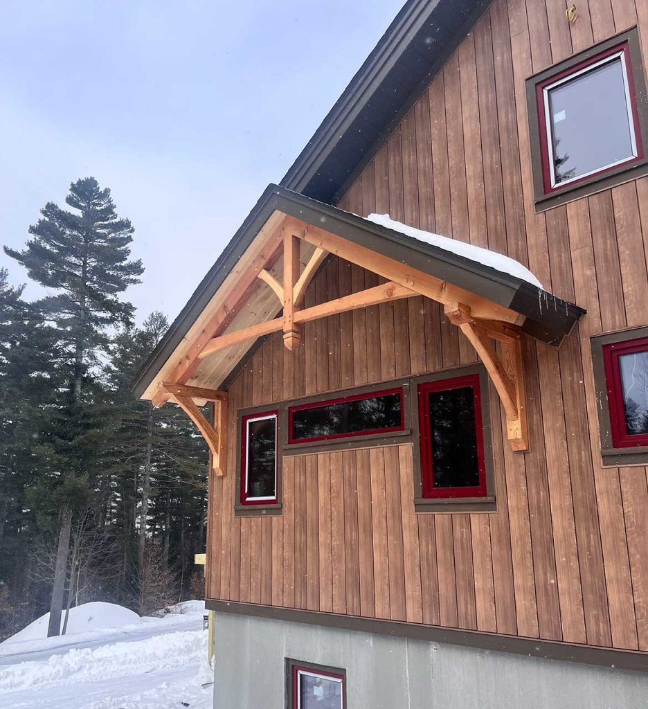 custom timber frame home constructed in Northern New England with locally sourced timber